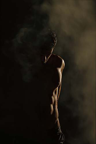 tehran province standing man in dim room iran